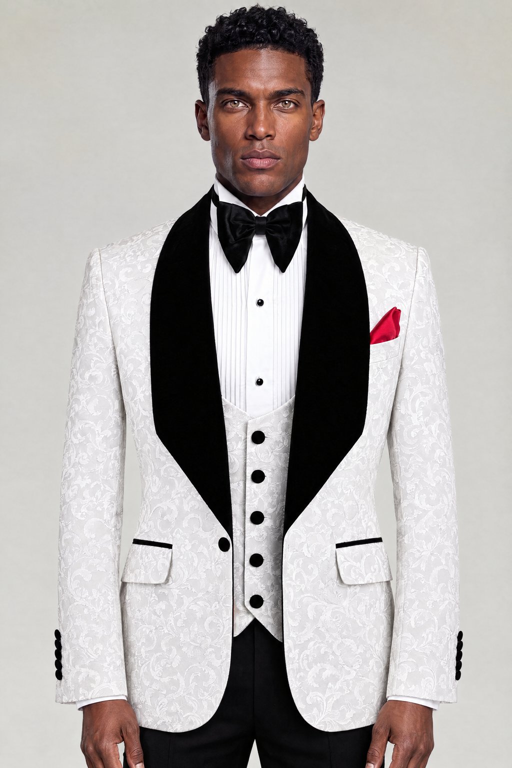 Front portrait of a white damask tuxedo with wide black velvet lapels and matching vest from Gentleman's Guru