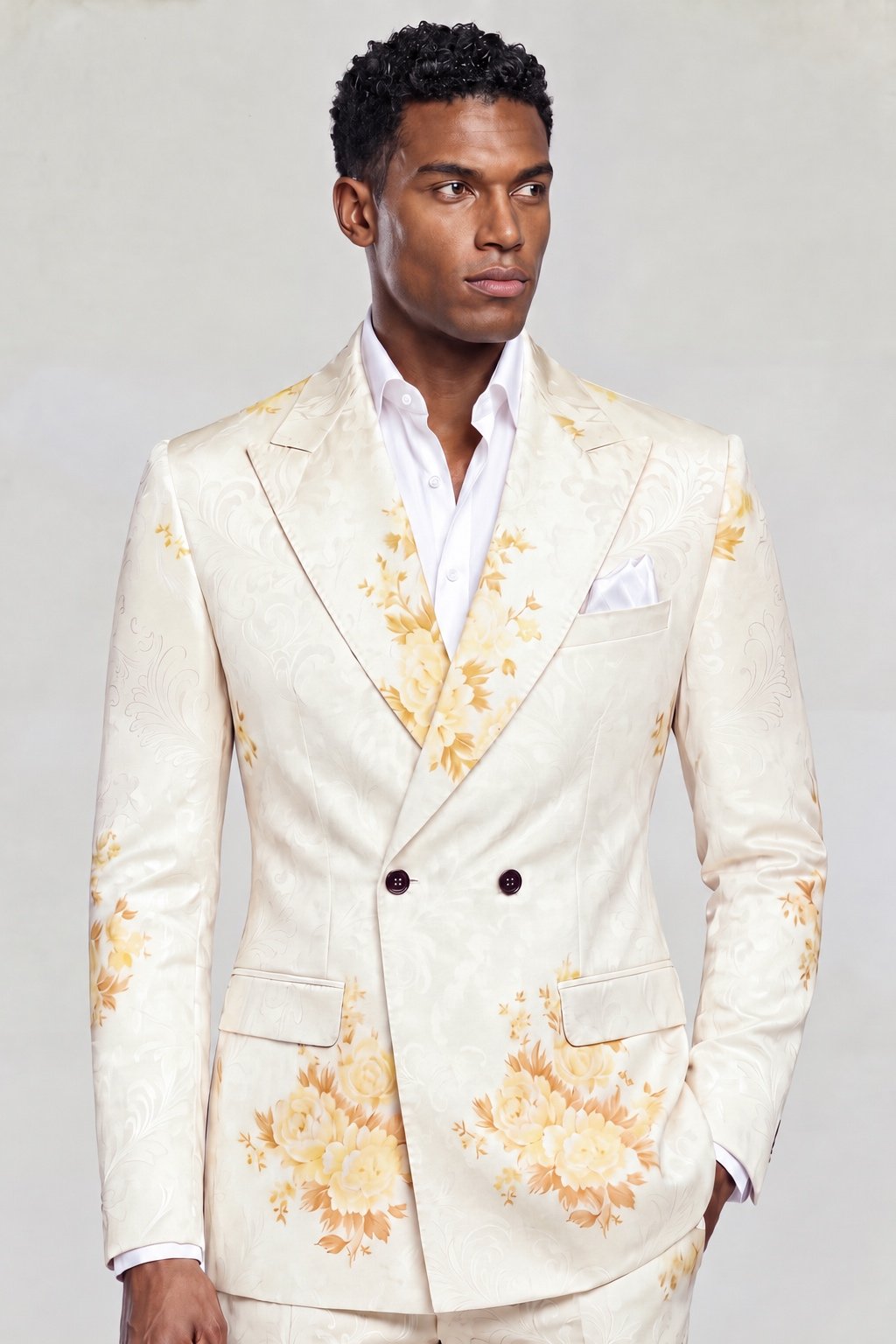 Men&rsquo;s cream floral double breasted suit with matching trousers, peak lapels and an open-collar white shirt from Gentleman&rsquo;s Guru